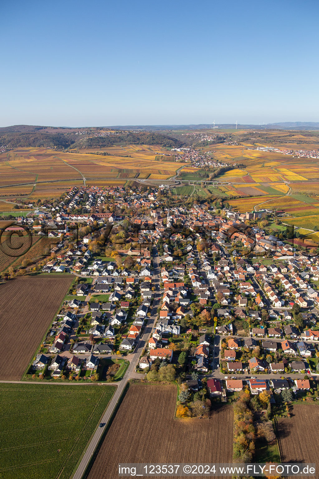 Oblique view of Autumnal colored village view in the district Jerusalemsberg in Kirchheim an der Weinstraße in the state Rhineland-Palatinate, Germany