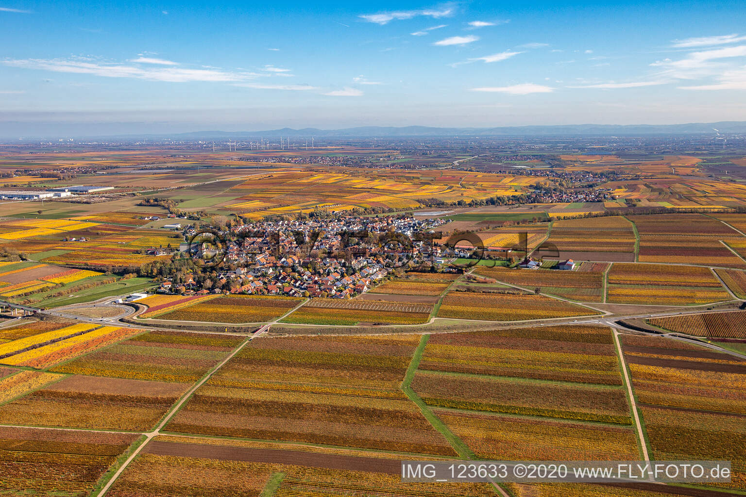 Autumnal discolored village view in Kirchheim an der Weinstrasse in the state Rhineland-Palatinate, Germany seen from above