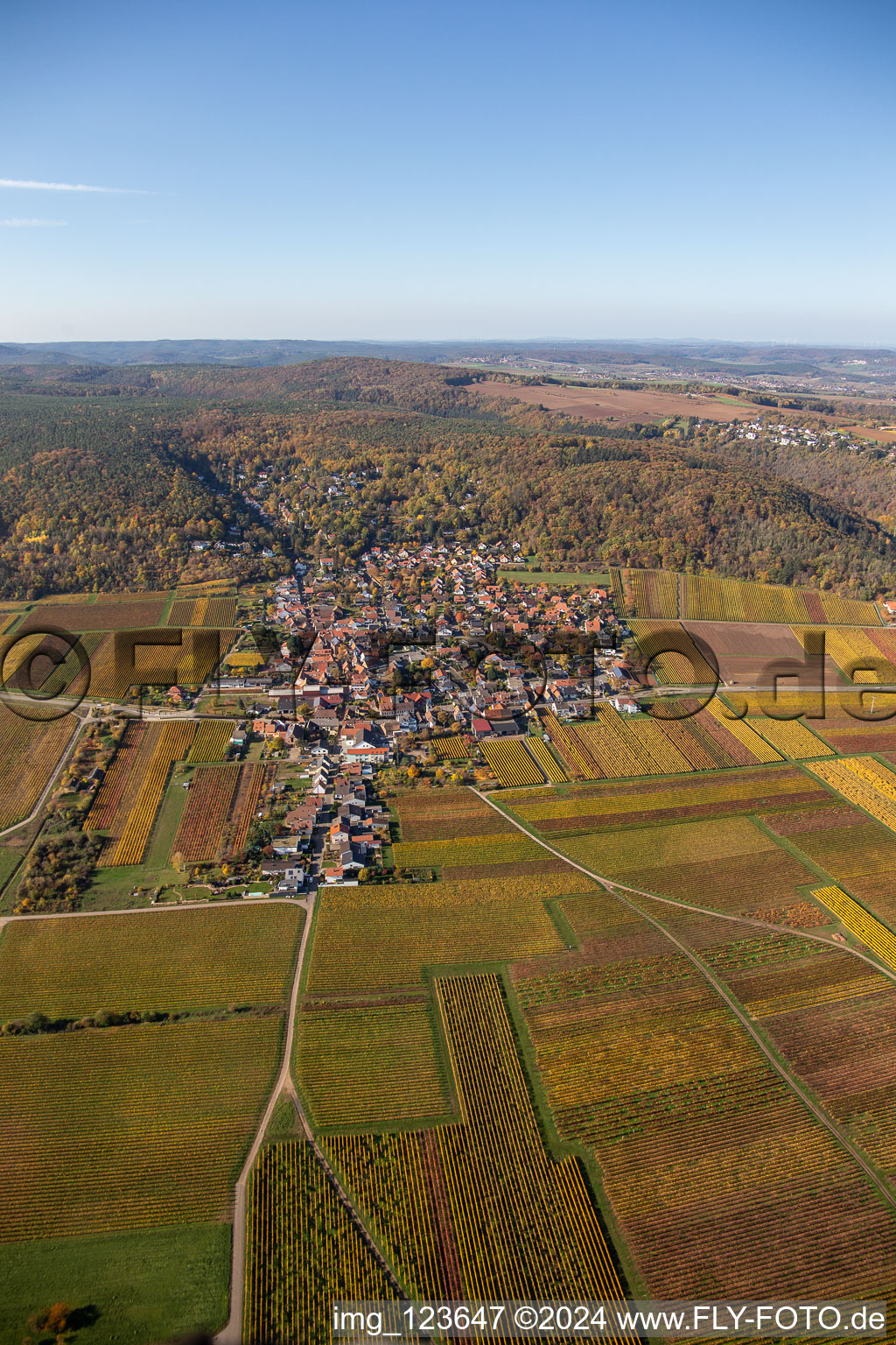 Autumnal discolored vegetation view of the rhine valley landscape surrounded by Palatinian mountains in Bobenheim am Berg in the state Rhineland-Palatinate, Germany