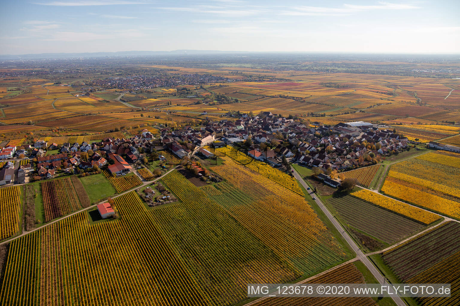 Aerial view of Autumnal discolored vegetation view village - view on the edge of wine yards in Herxheim am Berg in the state Rhineland-Palatinate, Germany