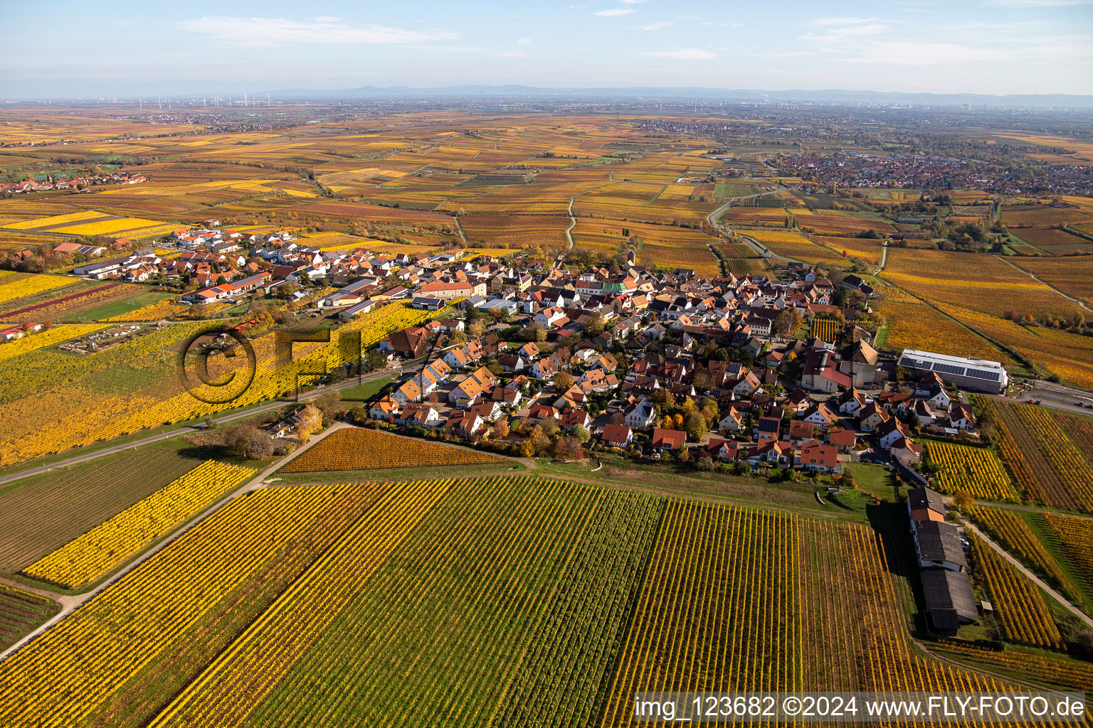 Aerial photograpy of Autumnal discolored vegetation view village - view on the edge of wine yards in Herxheim am Berg in the state Rhineland-Palatinate, Germany