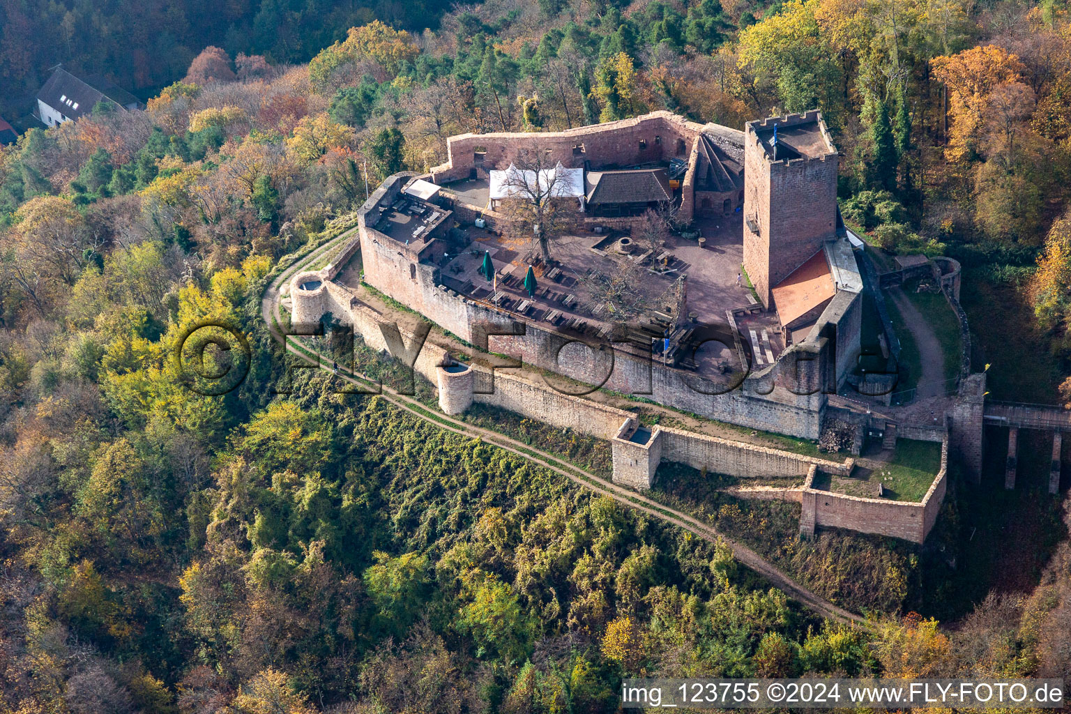 Aerial view of Autumnal discolored vegetation view ruins and vestiges of the former fortress Burg Landeck in Klingenmuenster in the state Rhineland-Palatinate, Germany