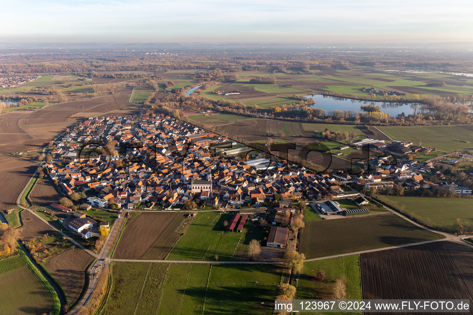 Drone recording of Agricultural land and field borders surround the settlement area of the village in Hardtwald in the state Rhineland-Palatinate, Germany