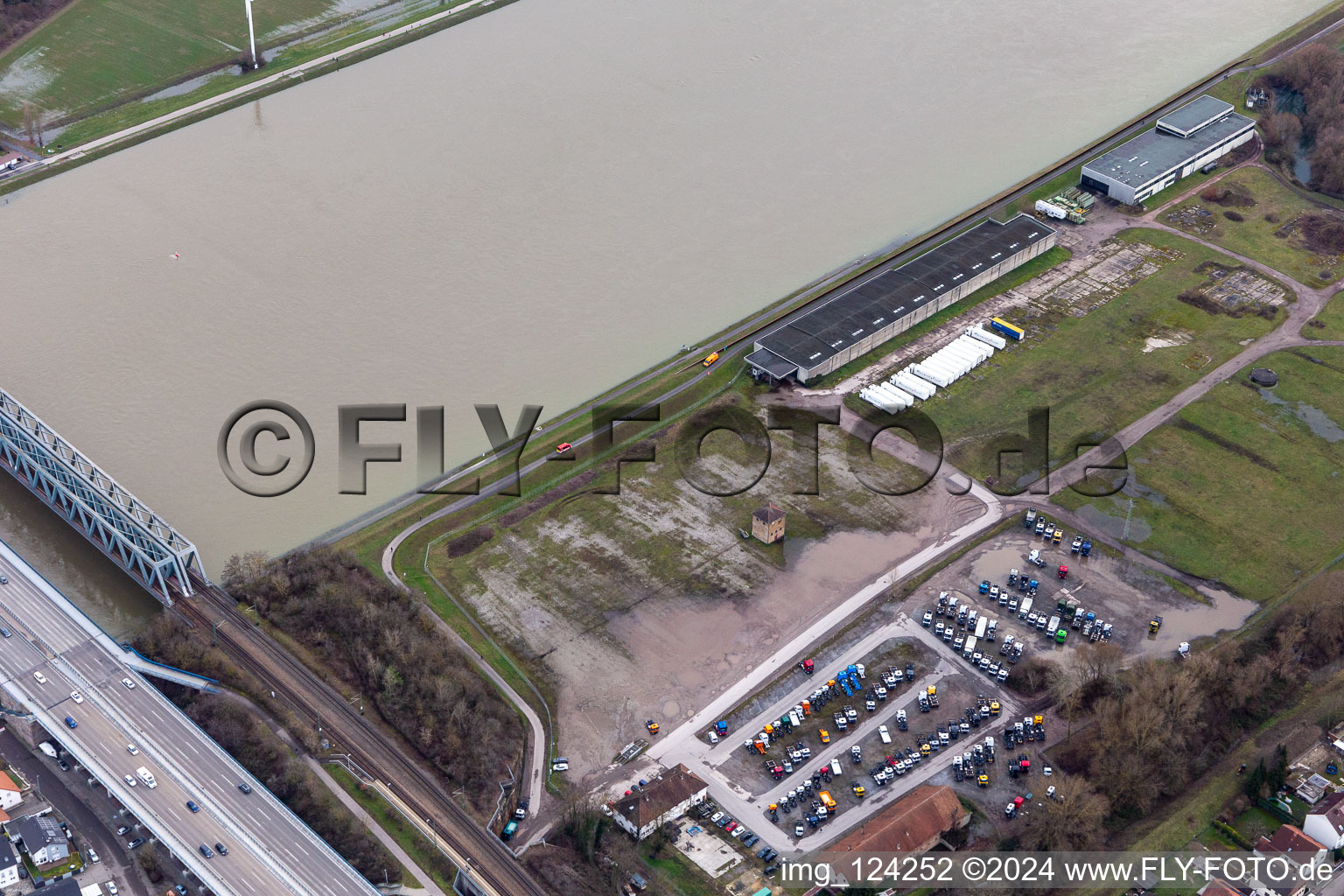 Aerial view of Cleared Daimler truck parking area in the flood area in front of the Rhine dam in the district Maximiliansau in Wörth am Rhein in the state Rhineland-Palatinate, Germany