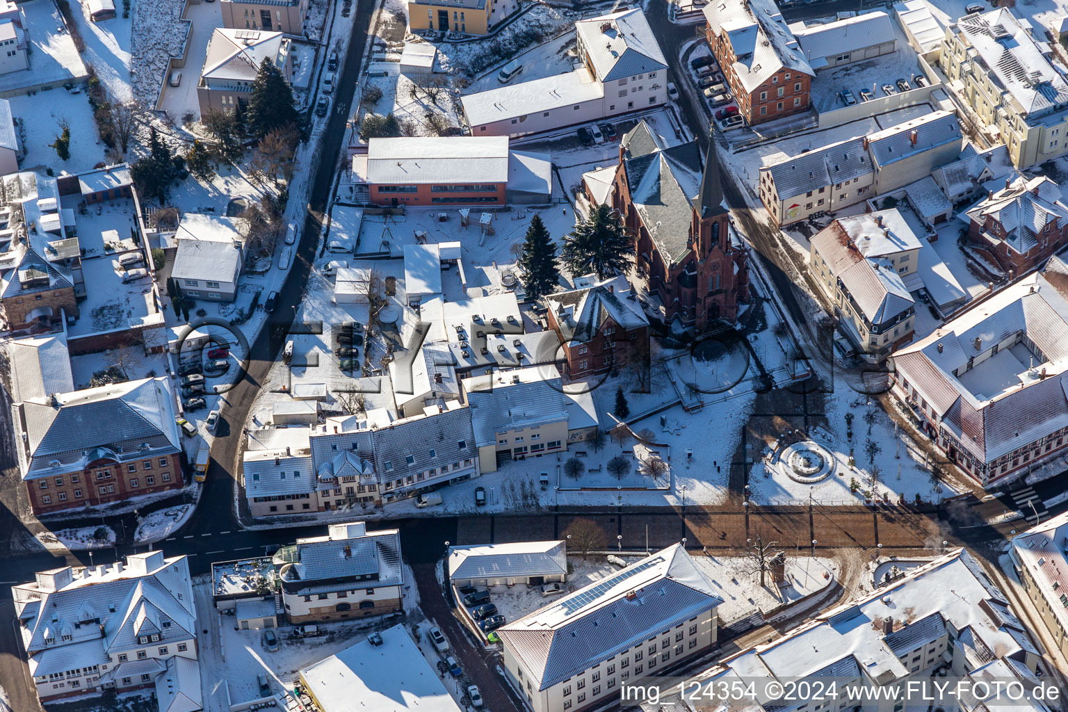 Wintry snowy church building of St. Martin at Ludwigsplatz in Bad Bergzabern in the state Rhineland-Palatinate, Germany