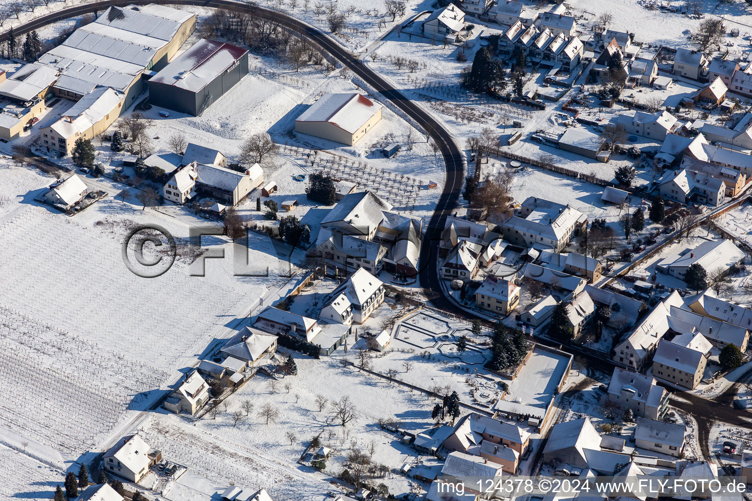 Winter aerial view in the snow from the Schlössl in Oberotterbach in the state Rhineland-Palatinate, Germany