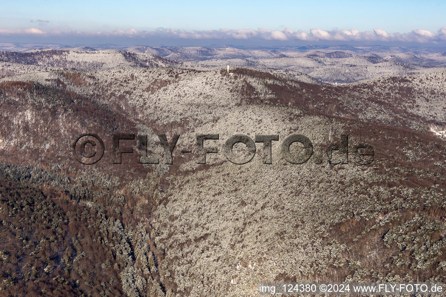 Winter aerial view in the snow of Dierbachtal with Stäffelsberg tower in Oberotterbach in the state Rhineland-Palatinate, Germany