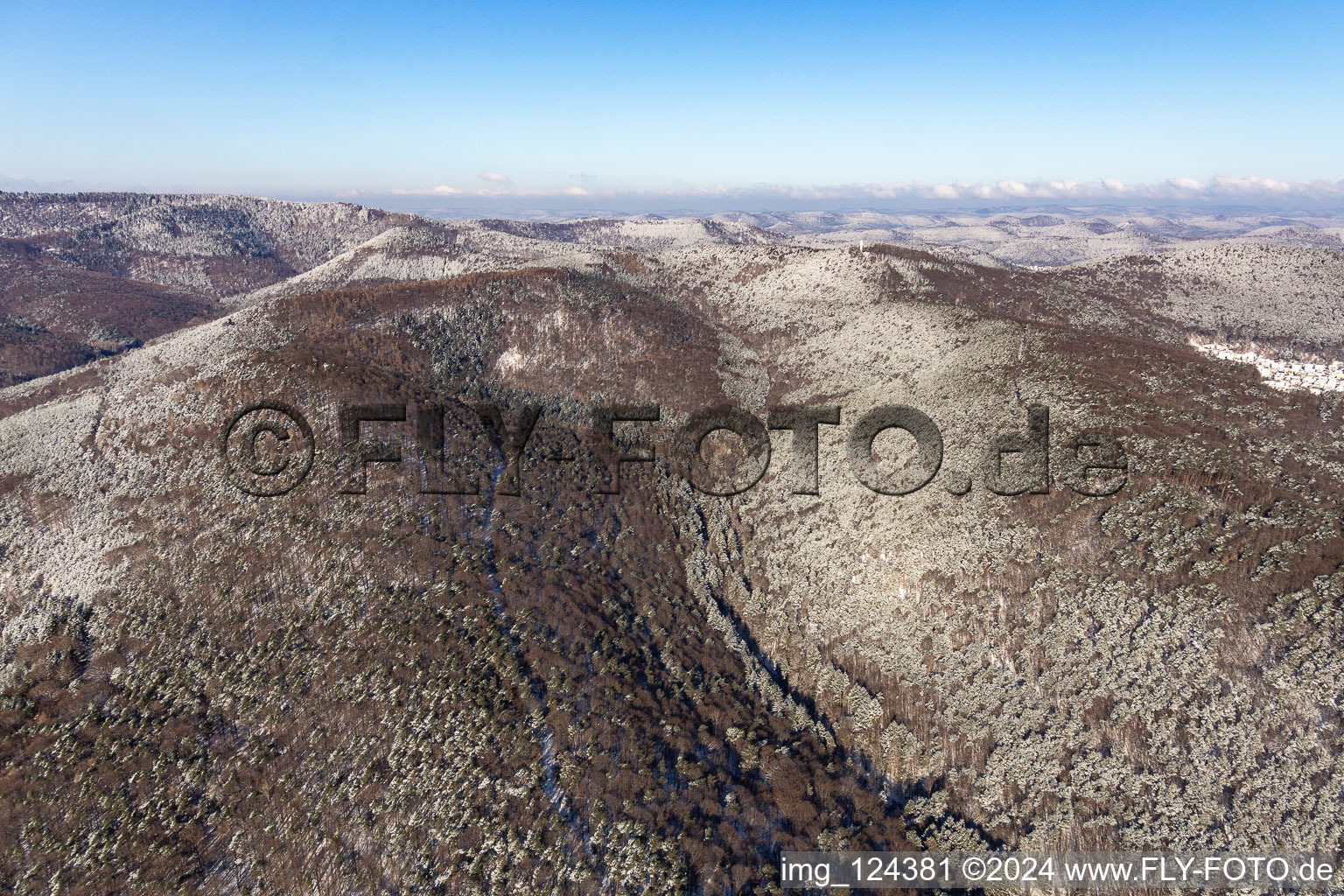 Aerial view of Winter aerial view in the snow of Dierbachtal with Stäffelsberg tower in Oberotterbach in the state Rhineland-Palatinate, Germany