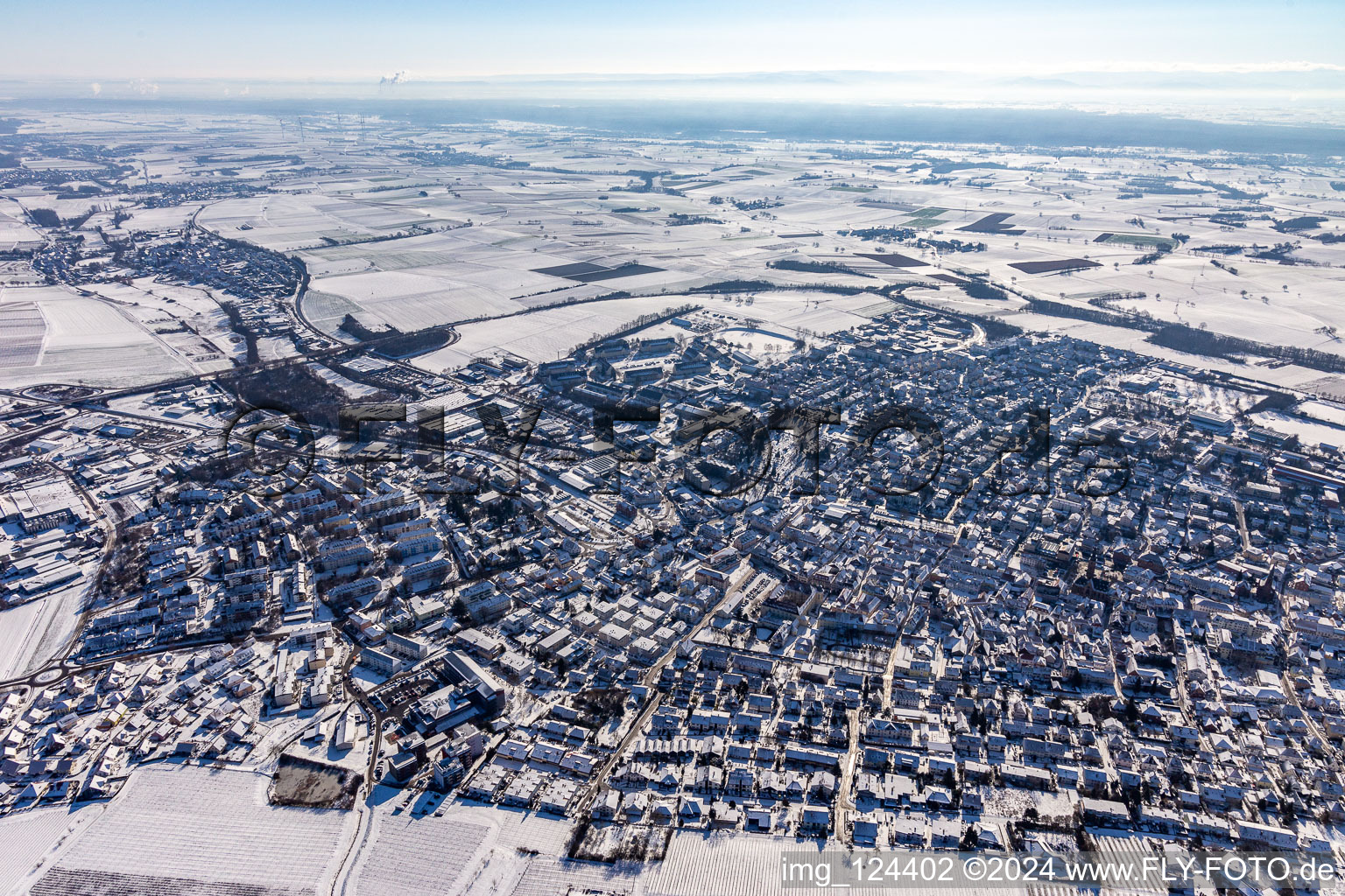 Aerial photograpy of Wintry snowy townscape with streets and houses of the residential areas in Bad Bergzabern in the state Rhineland-Palatinate