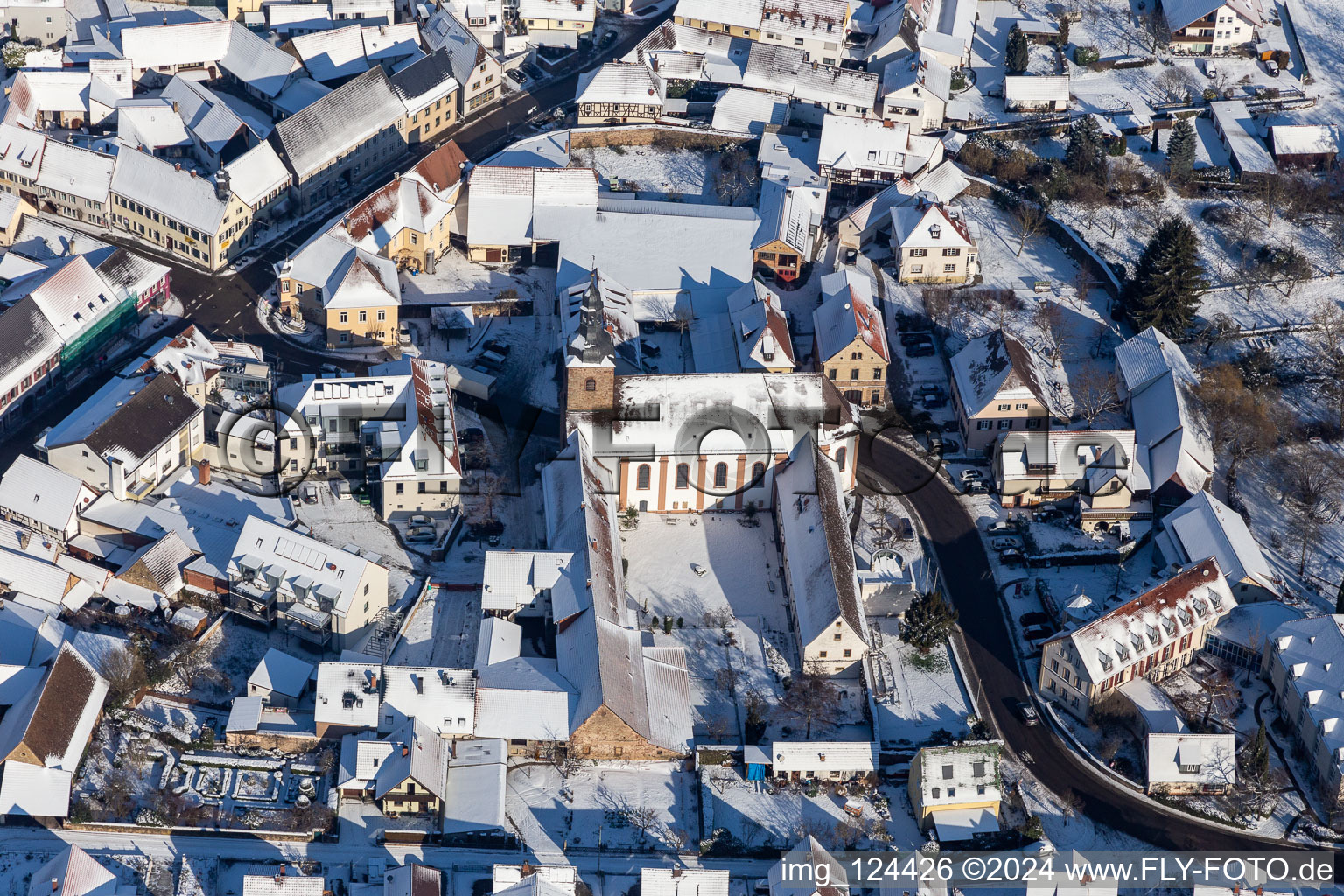 Winter aerial view in the snow of the monastery Klingenmünster in Klingenmünster in the state Rhineland-Palatinate, Germany