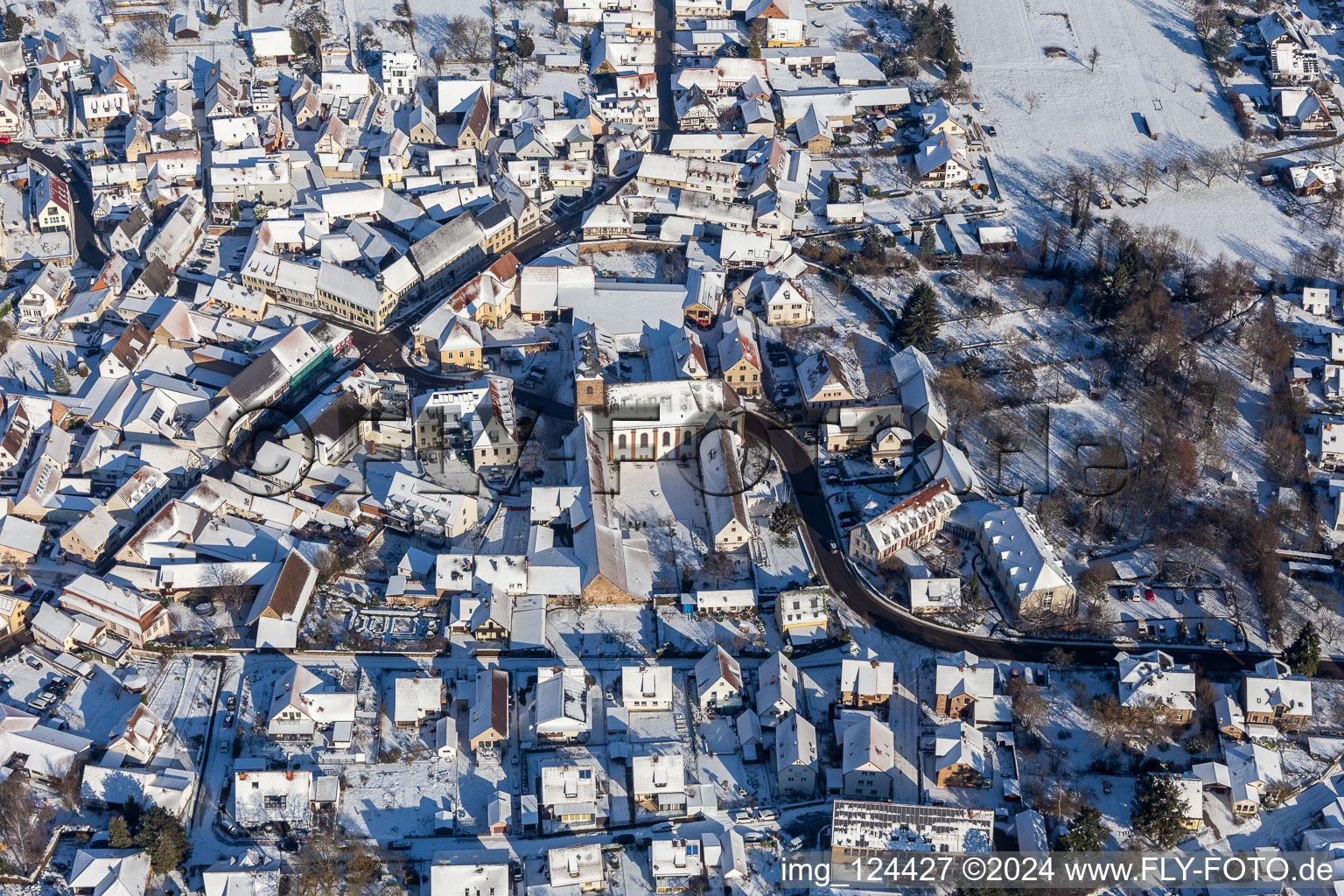 Aerial view of Winter aerial view in the snow of the monastery Klingenmünster in Klingenmünster in the state Rhineland-Palatinate, Germany