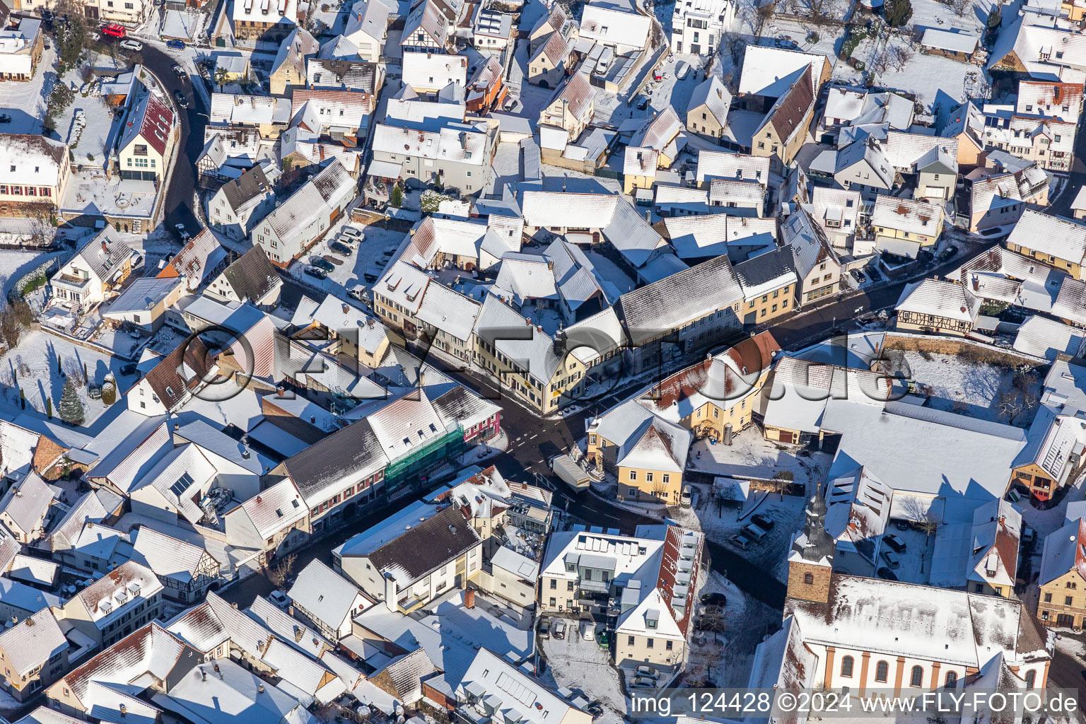 Winter aerial view in the snow of the town centre Klingenmünster in Klingenmünster in the state Rhineland-Palatinate, Germany