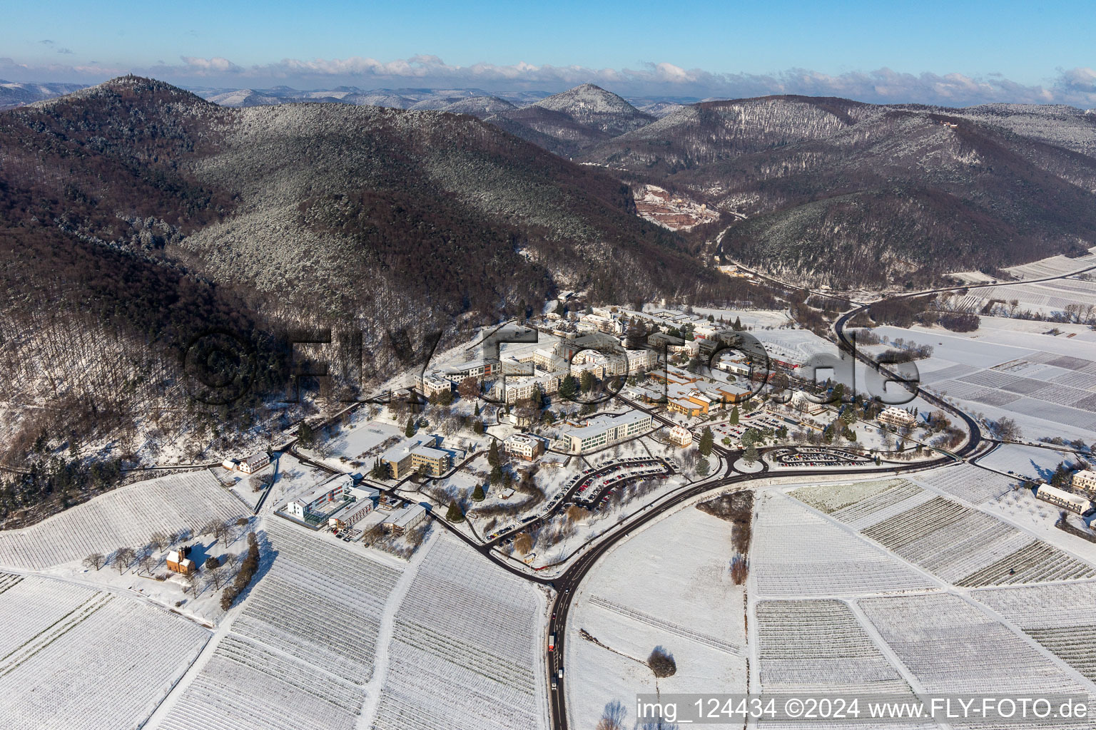 Aerial view of Wintry snowy hospital grounds of the Clinic Klinik fuer Kinder-/Jugendpsychiatrie and -psychotherapie in the district Pfalzklinik Landeck in Klingenmuenster in the state Rhineland-Palatinate, Germany