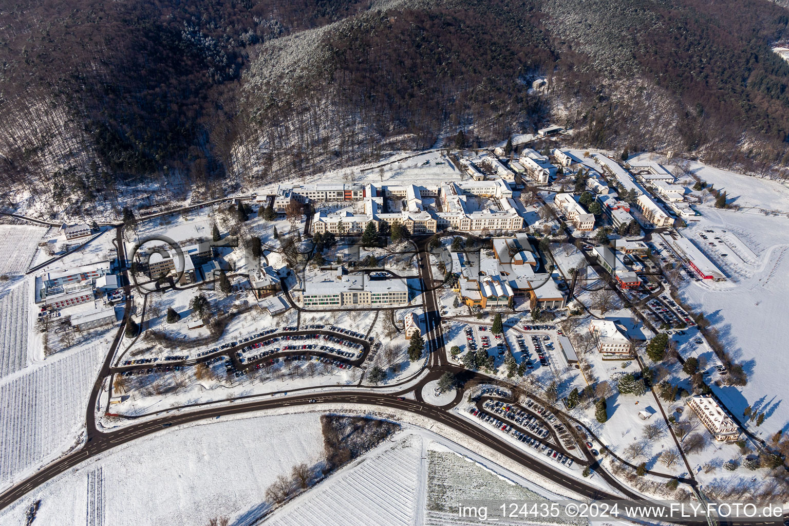 Aerial view of Winter aerial view in the snow of the Pfalzklinikum für Psychiatrie in Klingenmünster in the state Rhineland-Palatinate, Germany