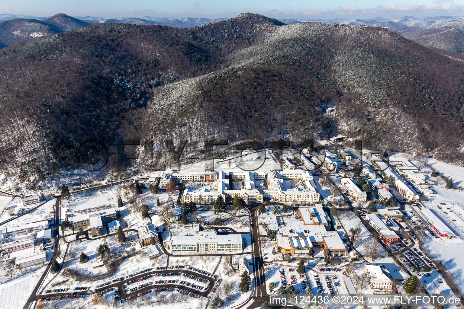 Aerial photograpy of Wintry snowy hospital grounds of the Clinic Klinik fuer Kinder-/Jugendpsychiatrie and -psychotherapie in the district Pfalzklinik Landeck in Klingenmuenster in the state Rhineland-Palatinate, Germany