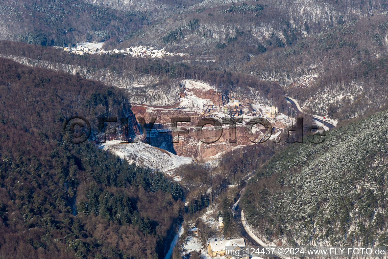 Winter aerial view in the snow of the PfalzGranit quarry in Waldhambach in the state Rhineland-Palatinate, Germany