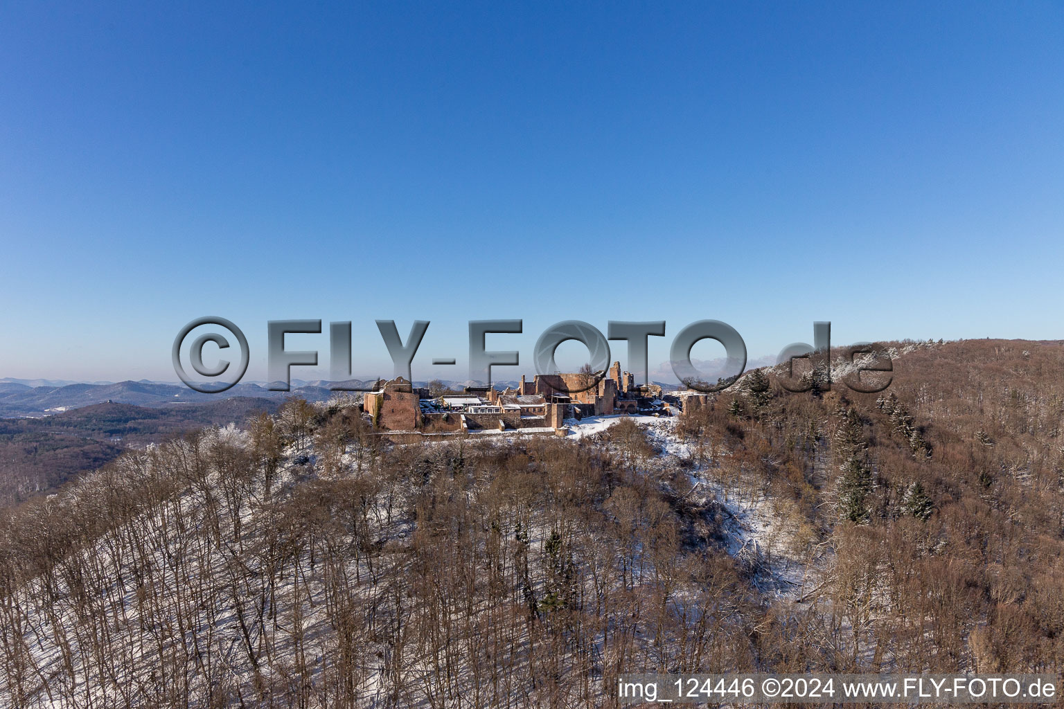 Wintry snowy ruins and vestiges of the former castle and fortress Burgruine Madenburg in Eschbach in the state Rhineland-Palatinate