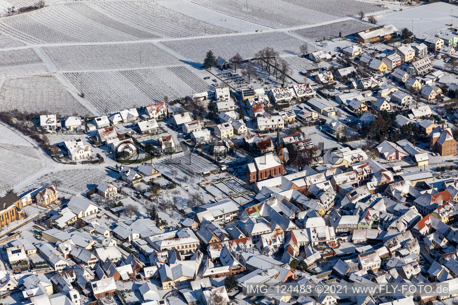 Winter aerial view in the snow of the Protestant church in Birkweiler in the state Rhineland-Palatinate, Germany