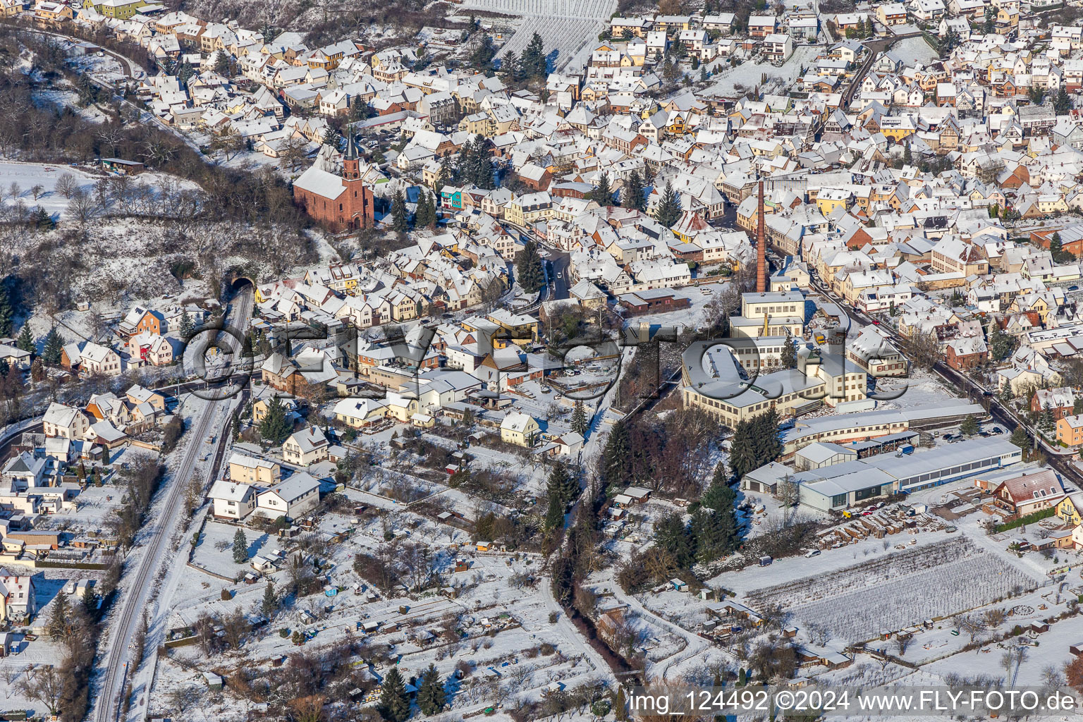 Winter aerial view in the snow of GET Metall and church in Albersweiler in the state Rhineland-Palatinate, Germany