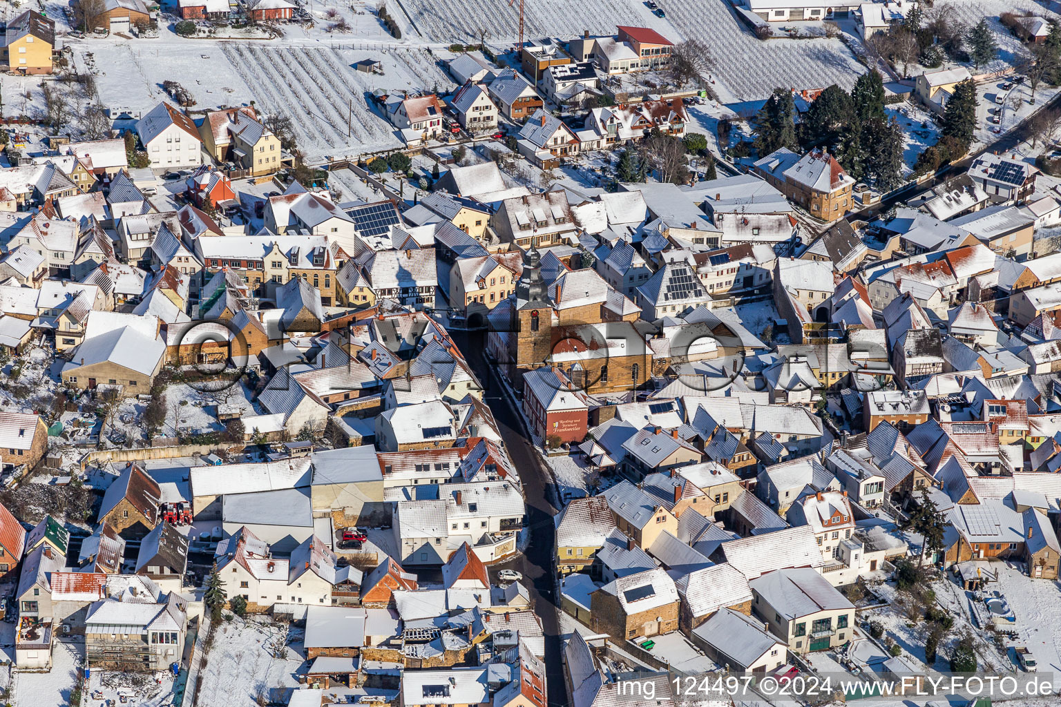 Winter aerial view in the snow of the Protestant church on the Weinstrasse in Frankweiler in the state Rhineland-Palatinate, Germany