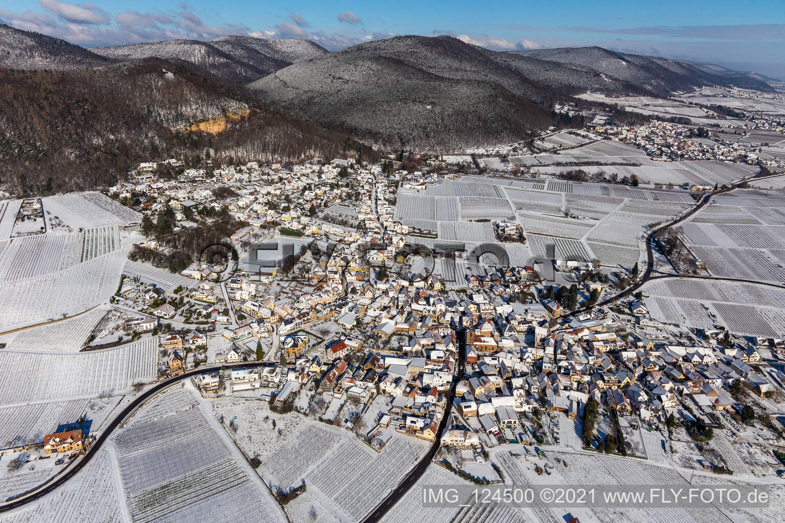 Aerial view of Wintry snowy Village - view on the edge of wine yards in Frankweiler in the state Rhineland-Palatinate, Germany