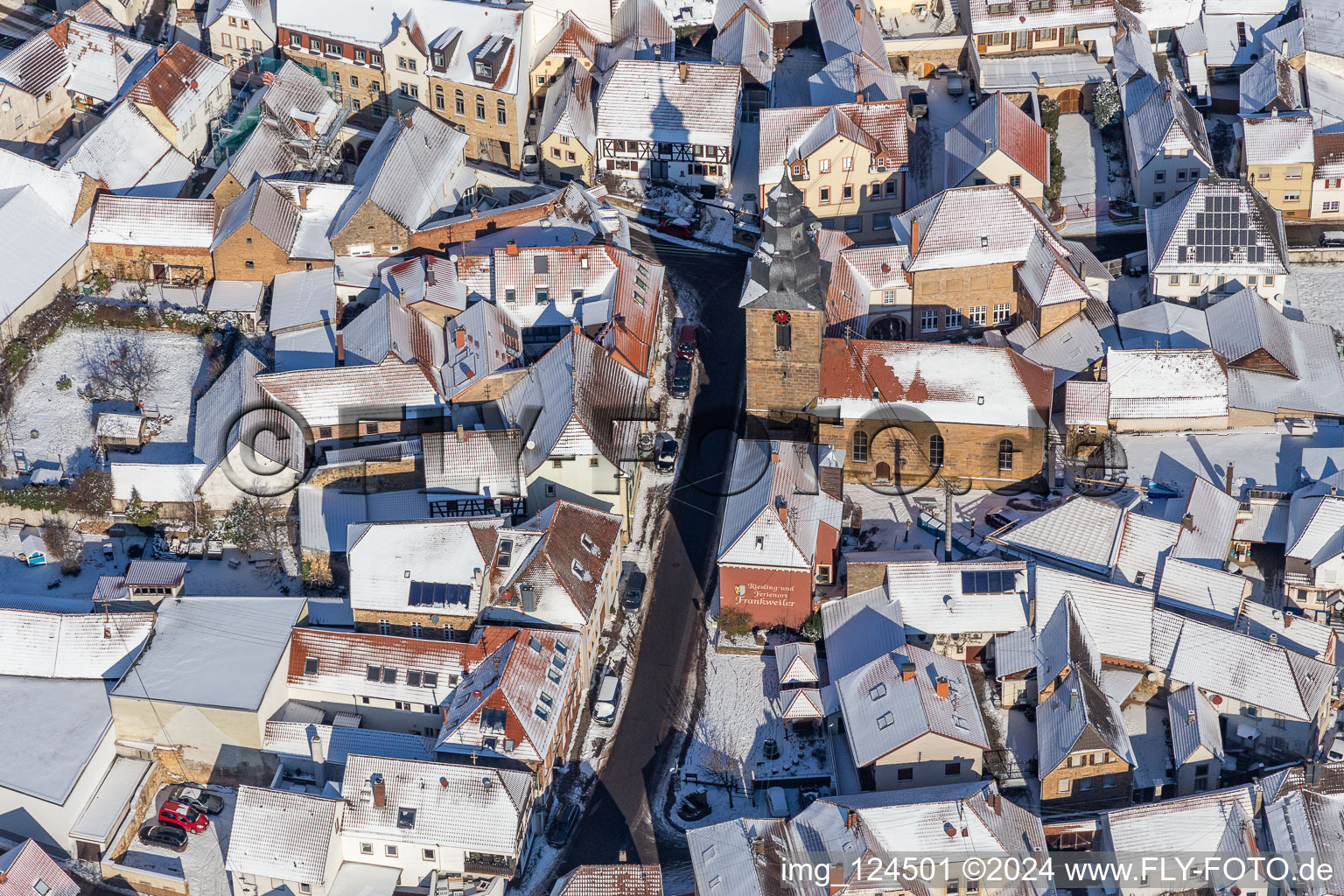 Aerial view of Winter aerial view in the snow of the Protestant church on the Weinstrasse in Frankweiler in the state Rhineland-Palatinate, Germany