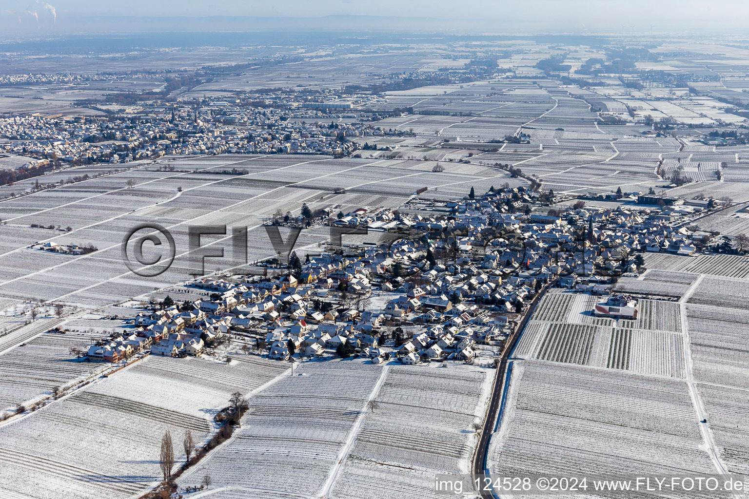 Winter aerial view in the snow in the district Rhodt in Rhodt unter Rietburg in the state Rhineland-Palatinate, Germany