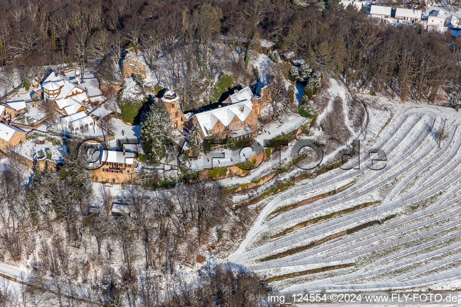 Aerial view of Winter aerial view in the snow of Kropsburg Castle in the district SaintMartin in Sankt Martin in the state Rhineland-Palatinate, Germany