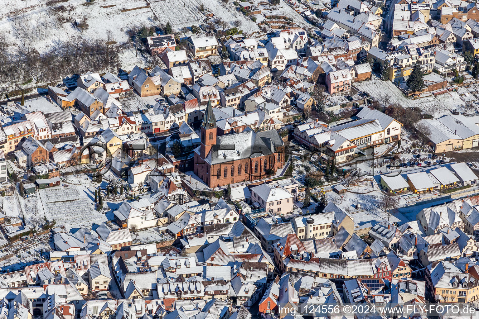 Wintry snowy church of St. Martin in Sankt Martin in the state Rhineland-Palatinate, Germany