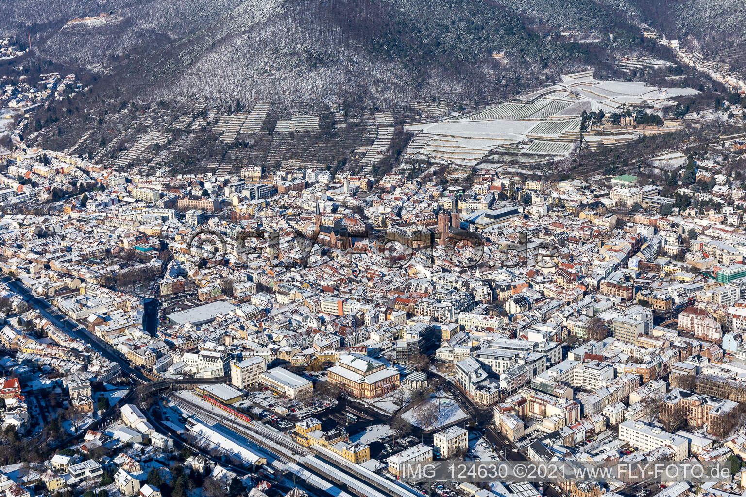 Aerial view of Winter aerial view in the snow with Catholic parish church of St. Mary and Protestant collegiate church in Neustadt an der Weinstraße in the state Rhineland-Palatinate, Germany