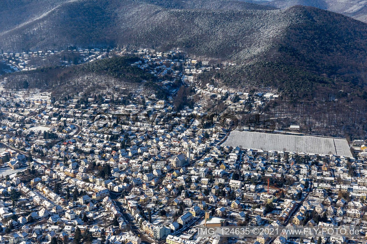 Winter aerial view in the snow Dr. Wirth Street in Neustadt an der Weinstraße in the state Rhineland-Palatinate, Germany