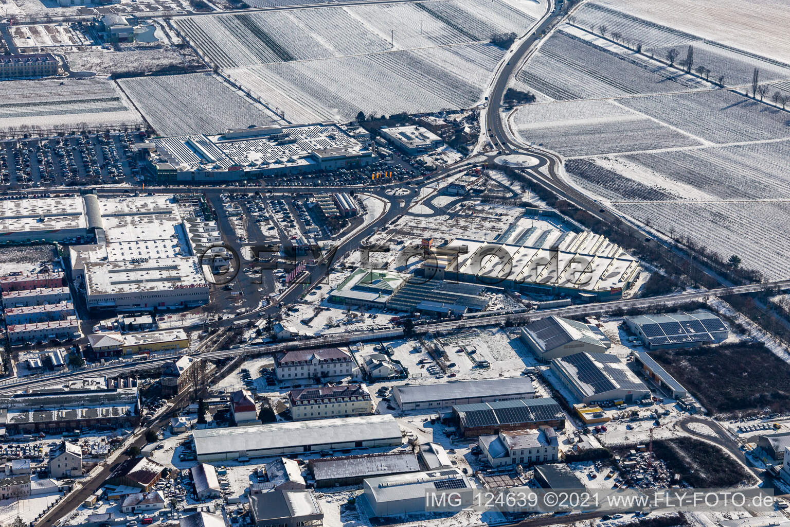 Winter aerial photograph in the snow Globus, Hela Profi, Dehner Markets in Neustadt an der Weinstraße in the state Rhineland-Palatinate, Germany