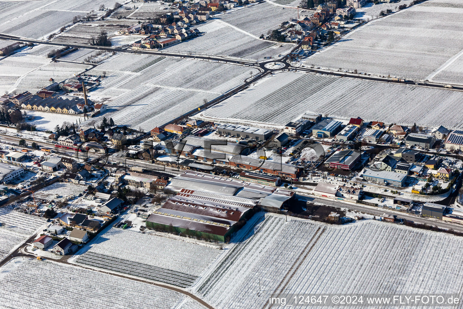 Aerial view of Winter aerial view in the snow industrial area Bordmühle in Kirrweiler in the state Rhineland-Palatinate, Germany