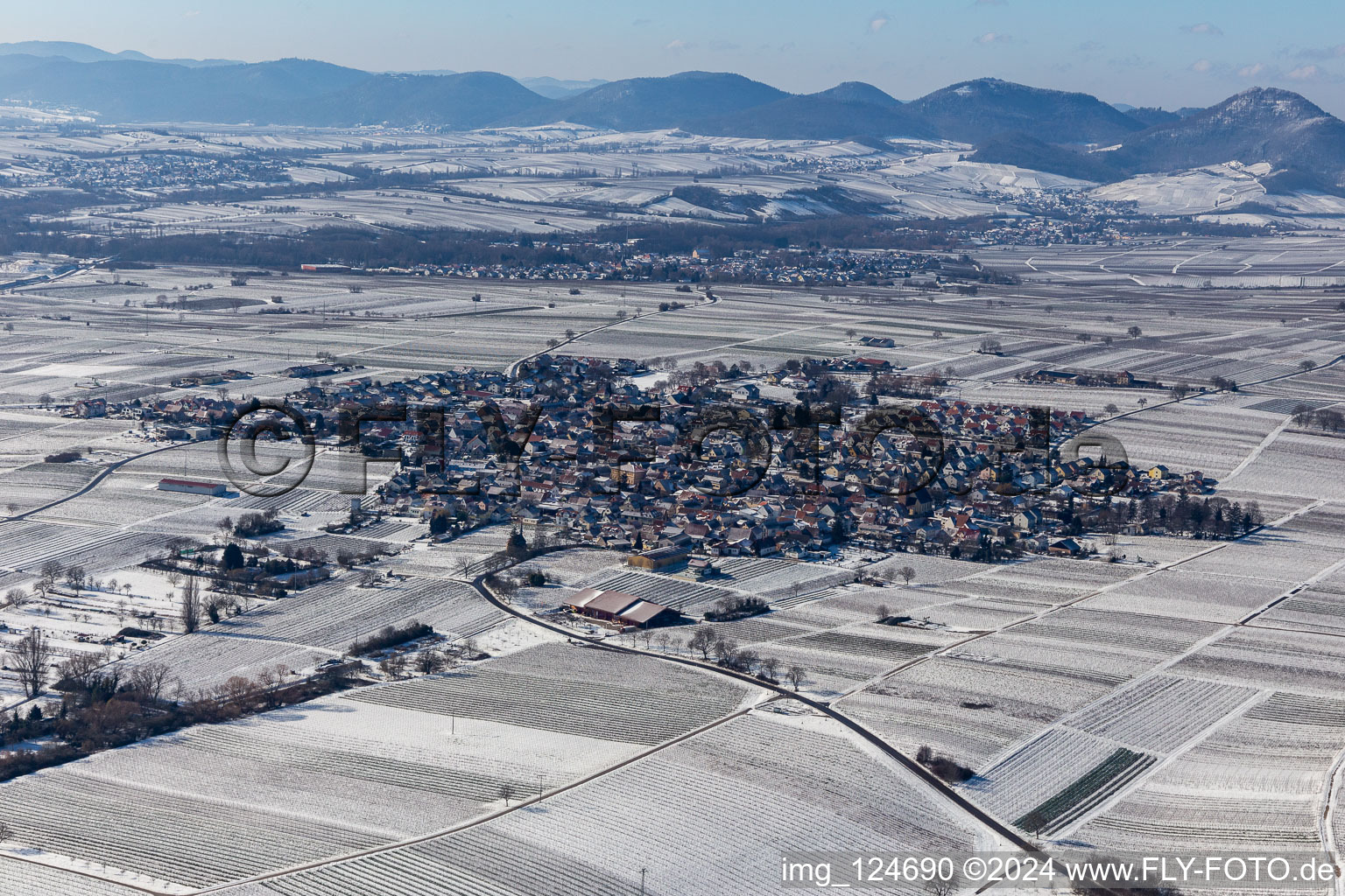 Wintry snowy town center on the edge of vineyards and wineries in the wine-growing area in Nussdorf in the state Rhineland-Palatinate, Germany