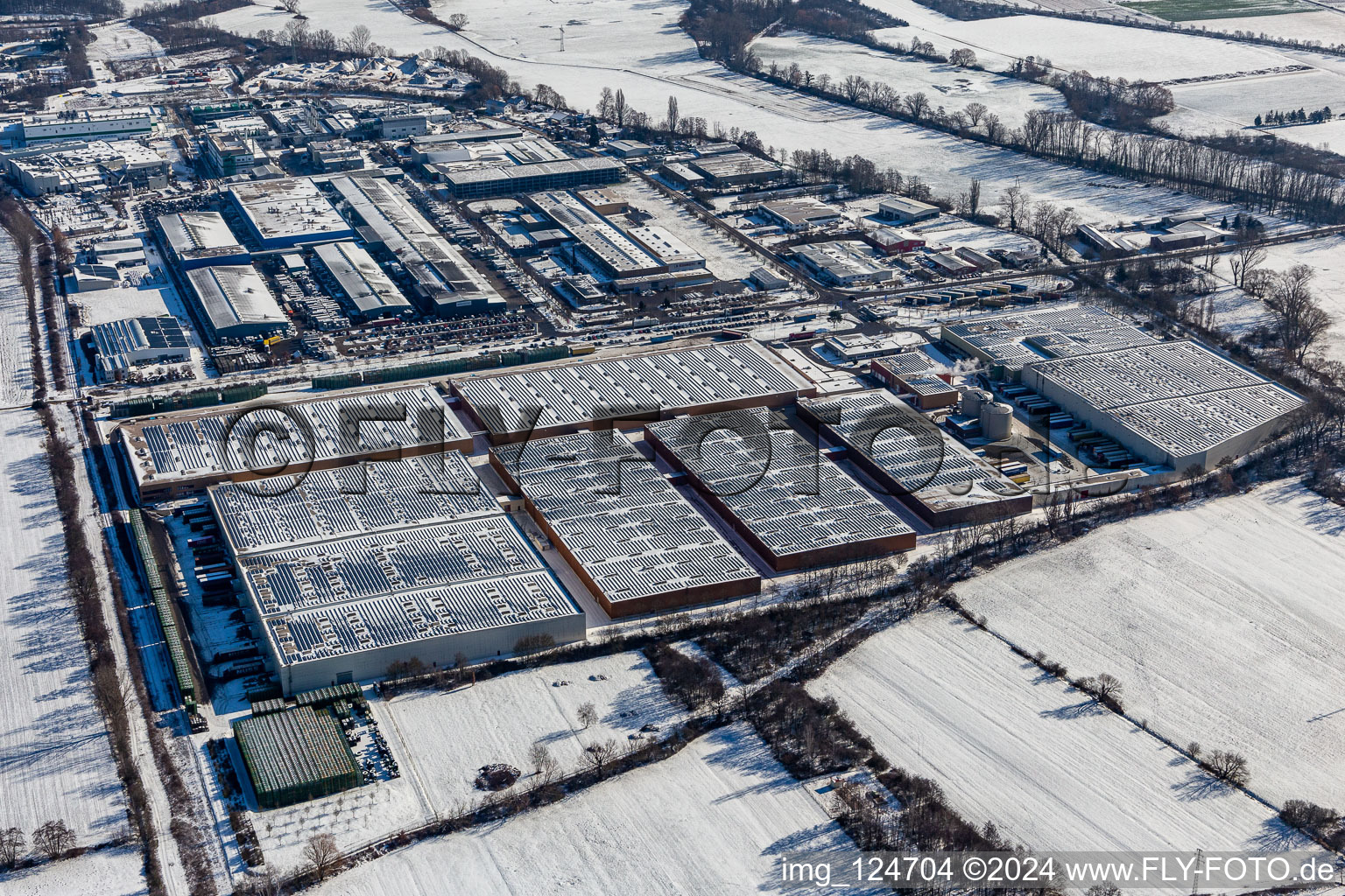 Wintry snowy industrial and commercial area Landau Ost with Michelin Tires and APL Automobil-Prueftechnik Landau GmbH in Landau in der Pfalz in the state Rhineland-Palatinate, Germany