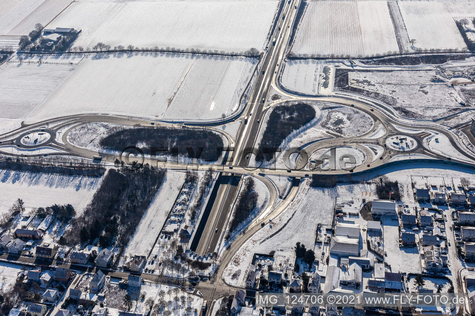 Winter aerial view in the snow motorway exit Landau Zentrum in the district Queichheim in Landau in der Pfalz in the state Rhineland-Palatinate, Germany