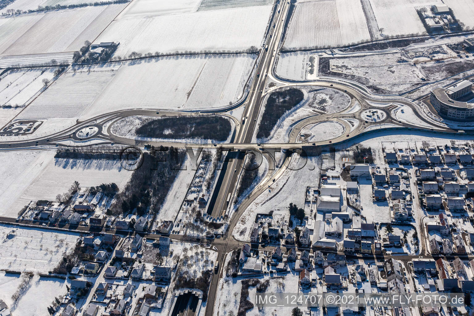 Aerial view of Winter aerial view in the snow motorway exit Landau Zentrum in the district Queichheim in Landau in der Pfalz in the state Rhineland-Palatinate, Germany