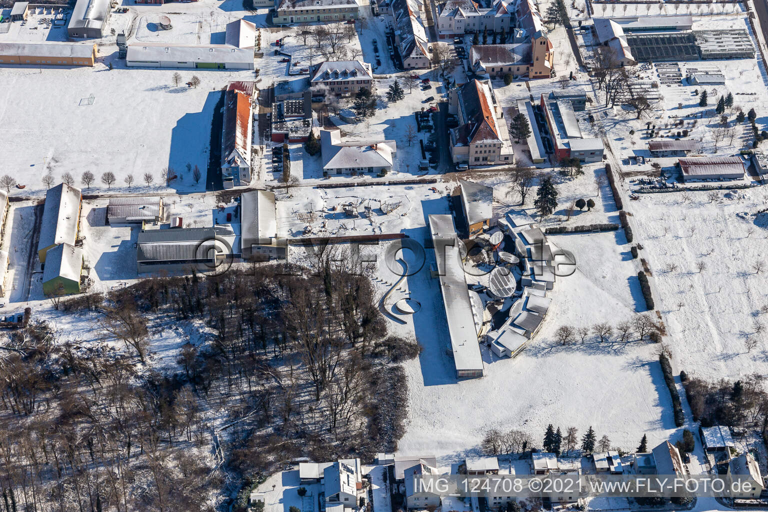 Winter aerial view in the snow of the St. Josef Youth Center and the Caritas Laurentius and Paul Support Center in the district Queichheim in Landau in der Pfalz in the state Rhineland-Palatinate, Germany