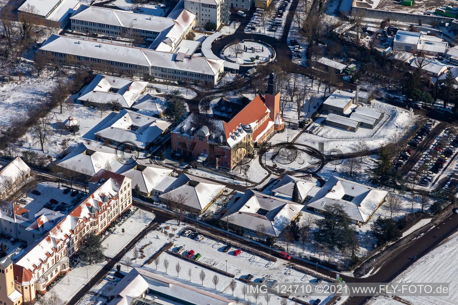Wintry snowy buildings of the Childrens and Youth Home Jugendwerk St. Josef in the district Queichheim in Landau in der Pfalz in the state Rhineland-Palatinate, Germany