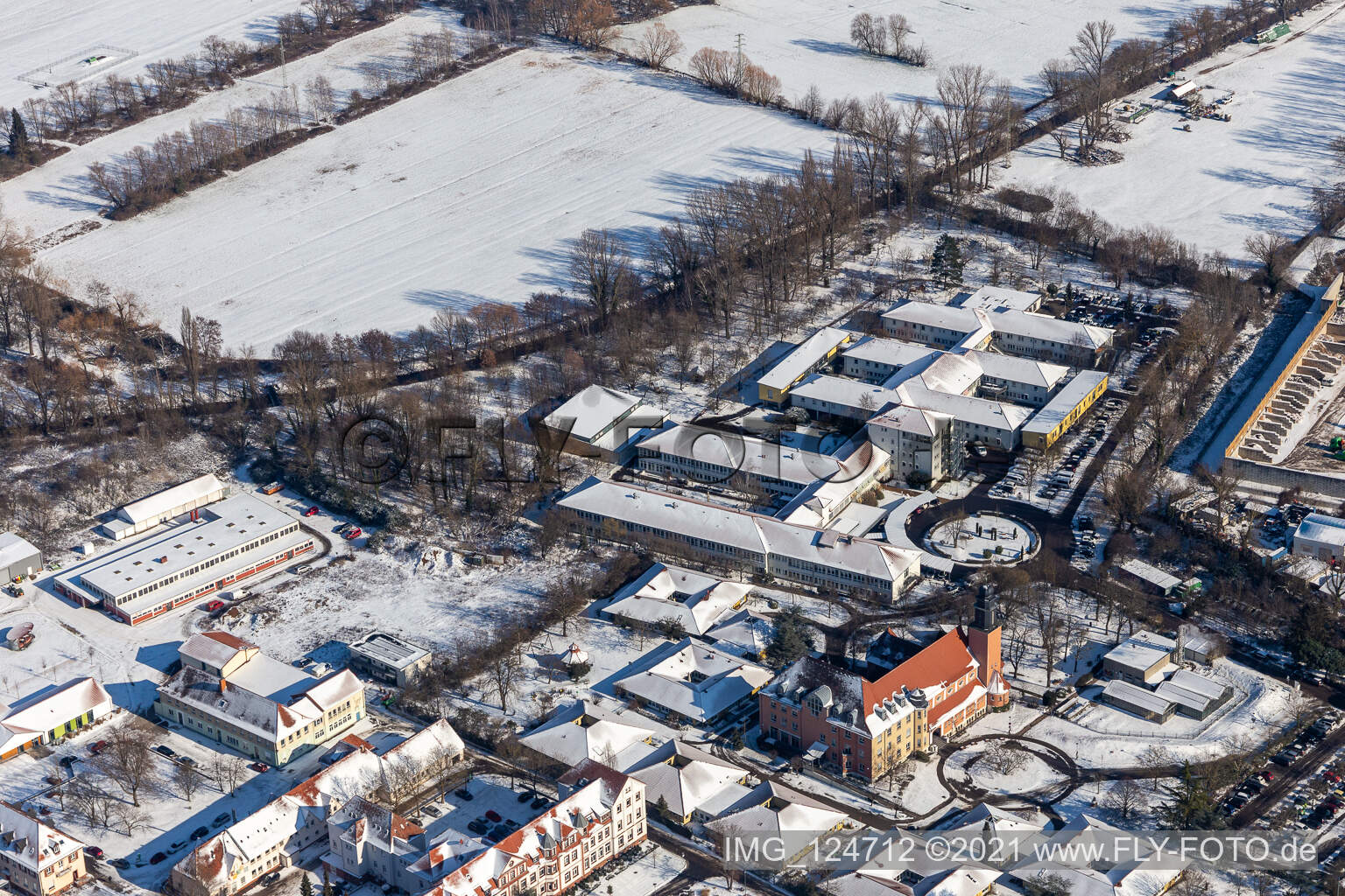 Aerial view of Winter aerial view in the snow of Jugendwerk St. Josef and Caritas Förderzentrum Laurentius und Paulus in the district Queichheim in Landau in der Pfalz in the state Rhineland-Palatinate, Germany