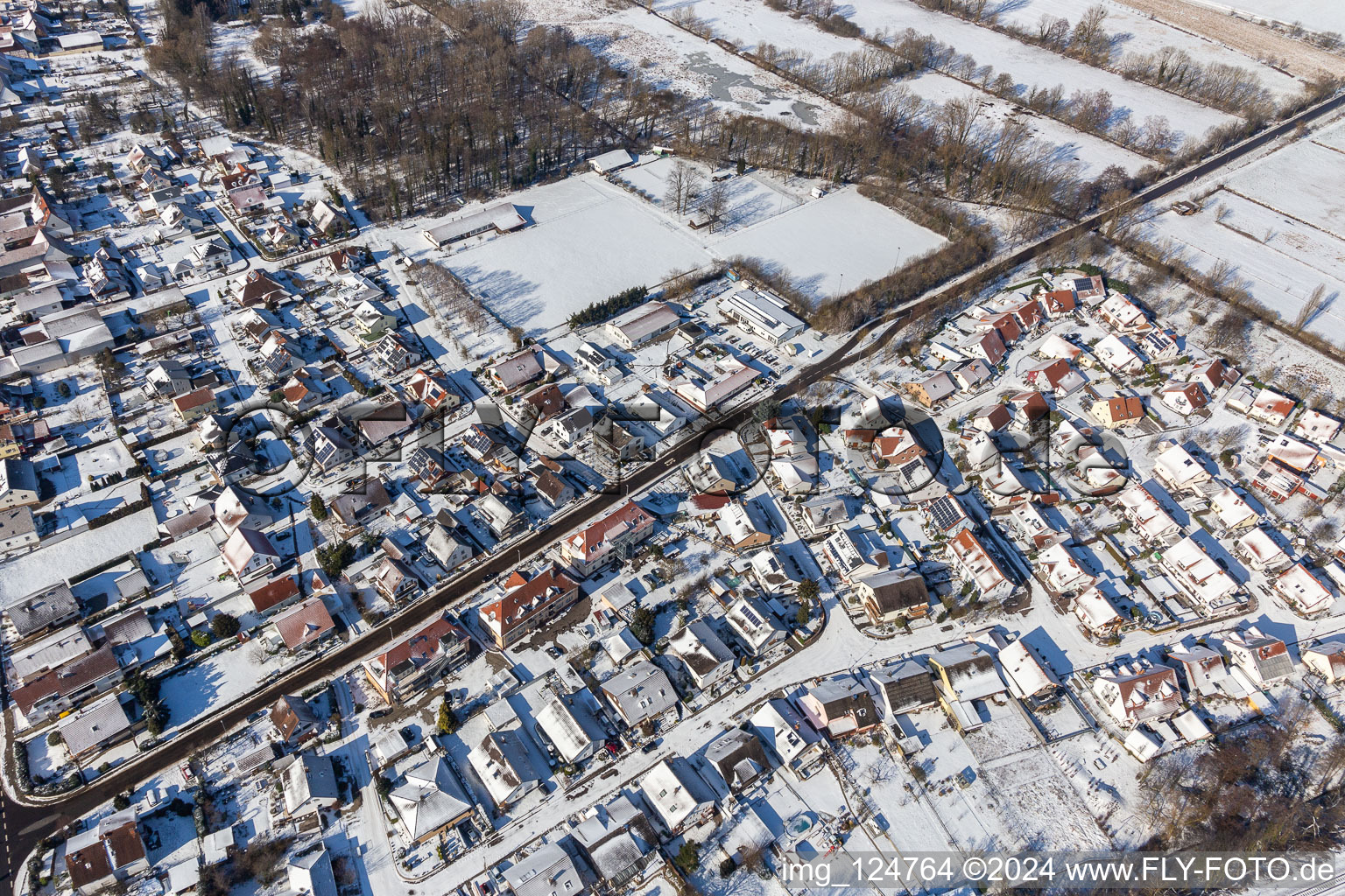 Winter aerial view in the snow Steinweilerer Straße in Winden in the state Rhineland-Palatinate, Germany