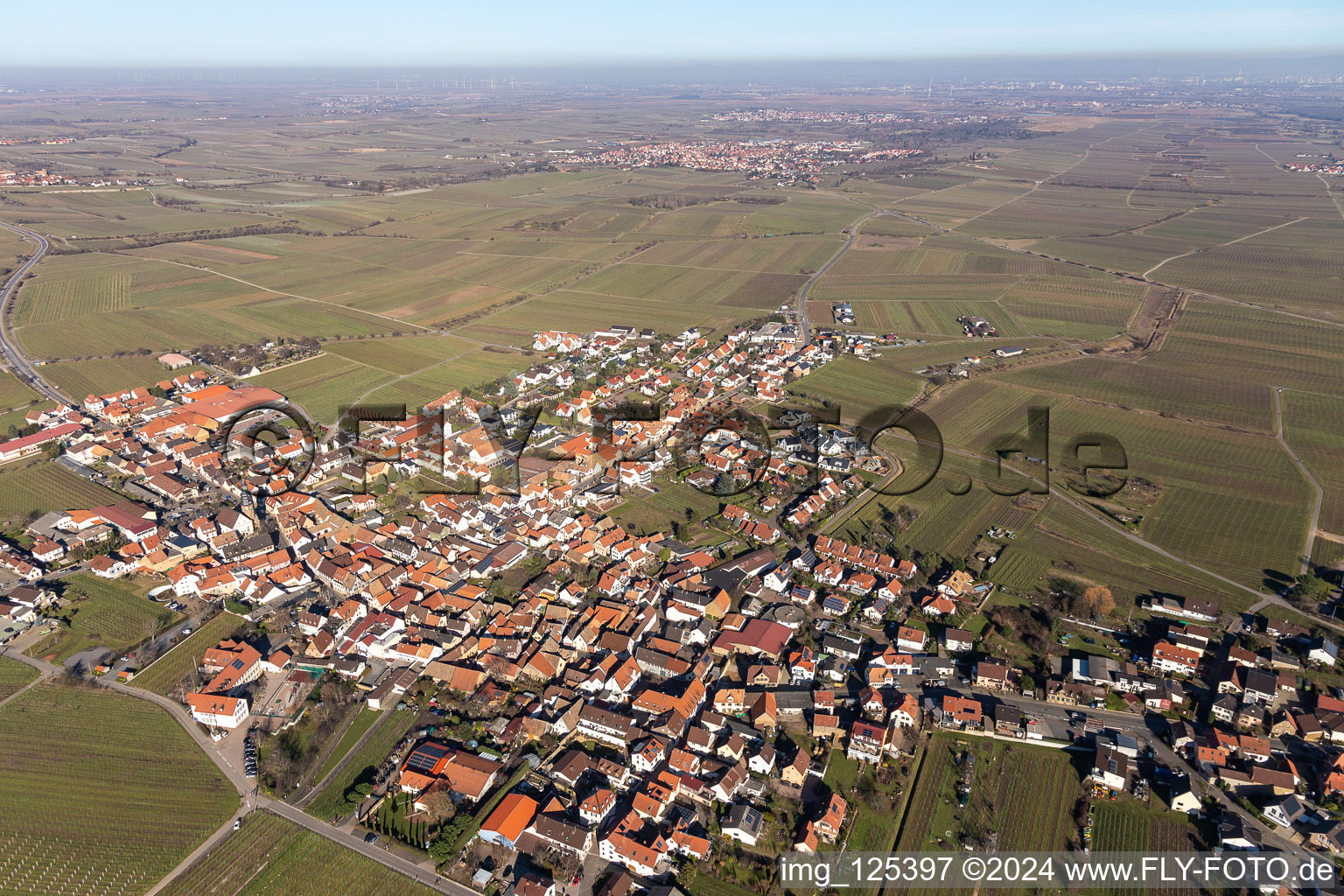 Aerial view of City view from the downtown area with the outskirts with adjacent agricultural fields in Kallstadt in the state Rhineland-Palatinate, Germany