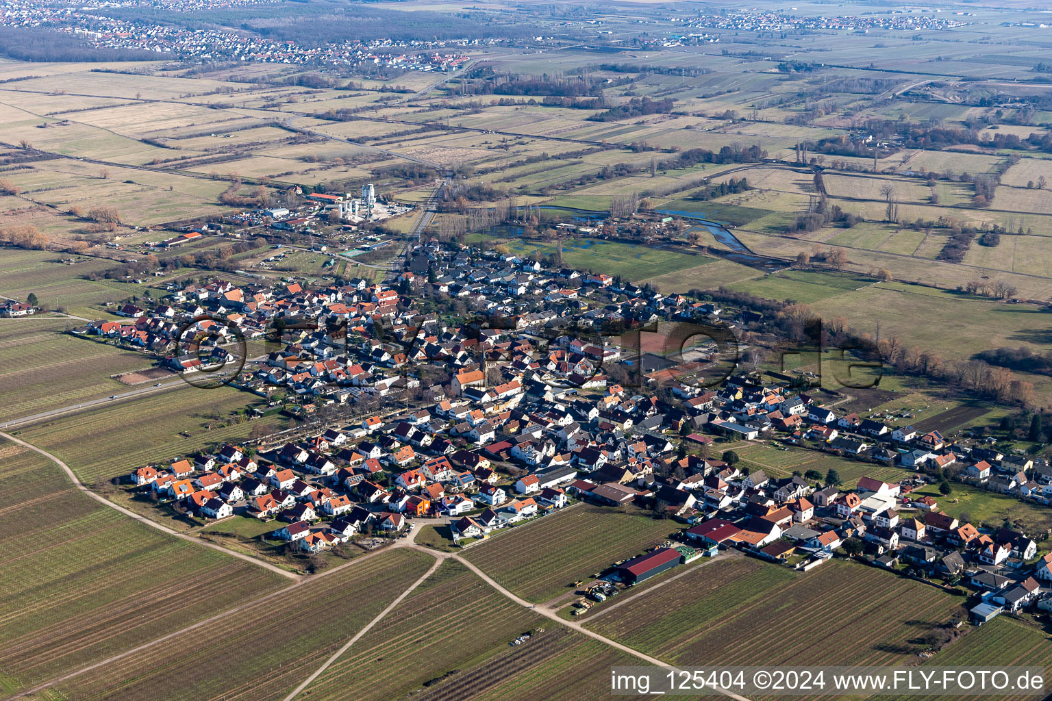 Aerial view of Village - view on the edge of agricultural fields and farmland in Erpolzheim in the state Rhineland-Palatinate