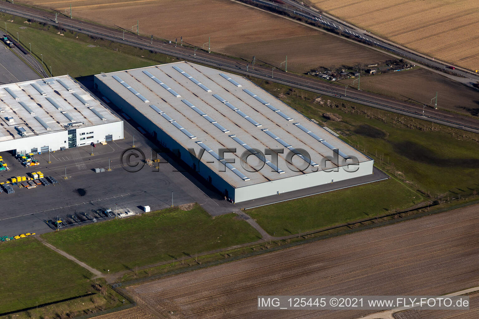 Oblique view of Buildings and production halls on the vehicle construction site of Joseph Voegele AG in the district Rheingoenheim in Ludwigshafen am Rhein in the state Rhineland-Palatinate, Germany
