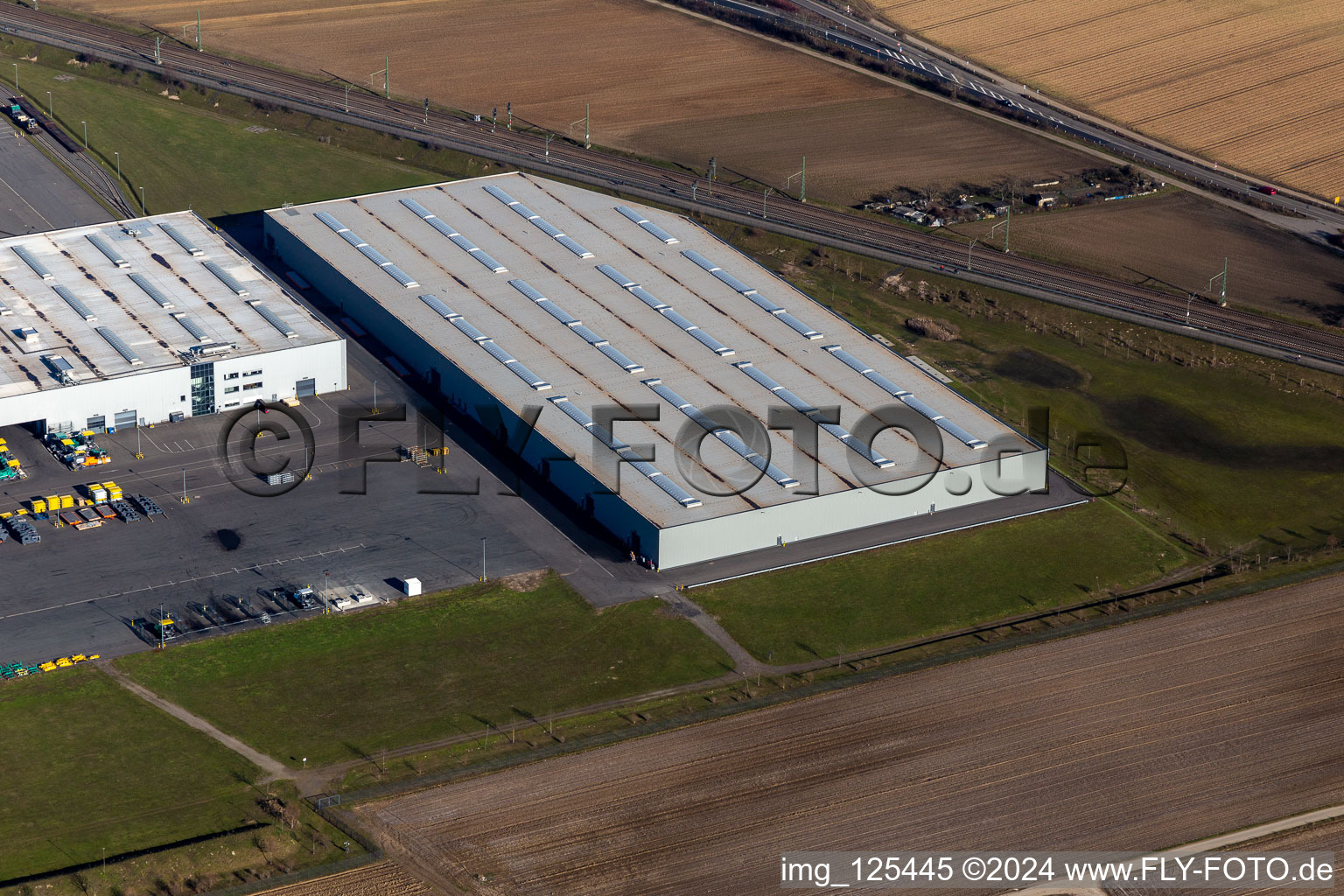 Oblique view of Buildings and production halls on the vehicle construction site of Joseph Voegele AG in the district Rheingoenheim in Ludwigshafen am Rhein in the state Rhineland-Palatinate, Germany