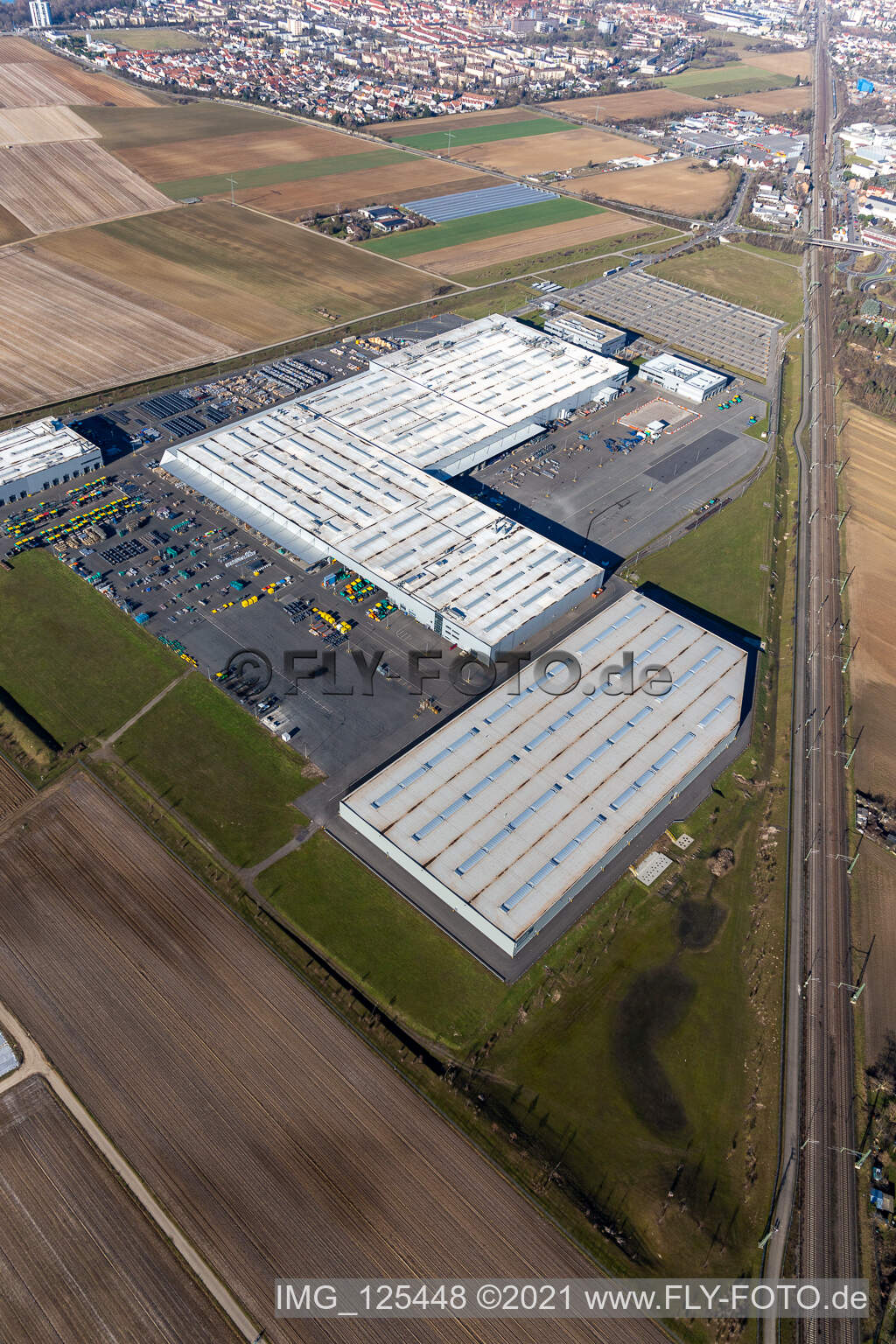 Buildings and production halls on the vehicle construction site of Joseph Voegele AG in the district Rheingoenheim in Ludwigshafen am Rhein in the state Rhineland-Palatinate, Germany seen from above