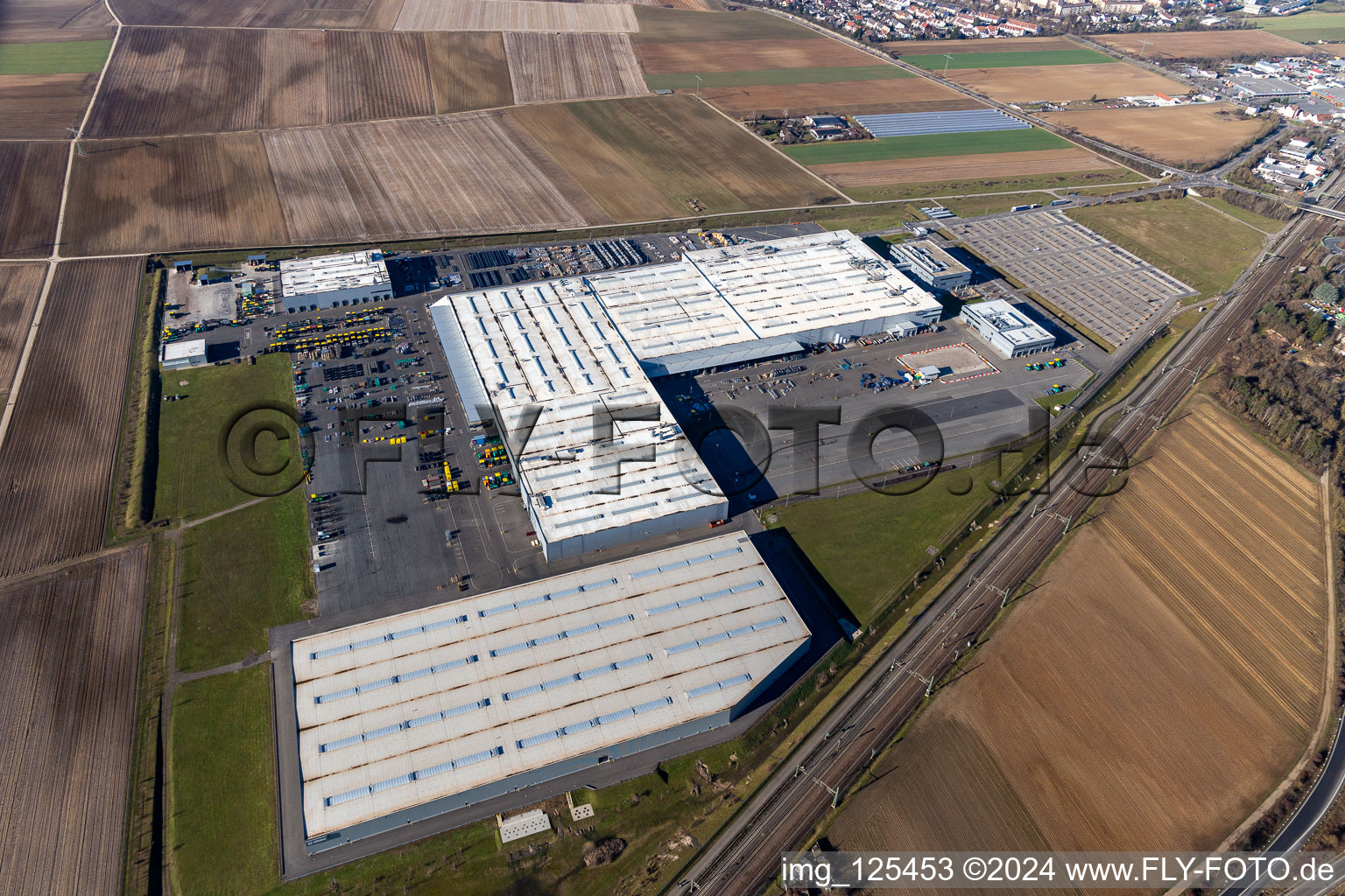 Buildings and production halls on the vehicle construction site of Joseph Voegele AG in the district Rheingoenheim in Ludwigshafen am Rhein in the state Rhineland-Palatinate, Germany from the plane