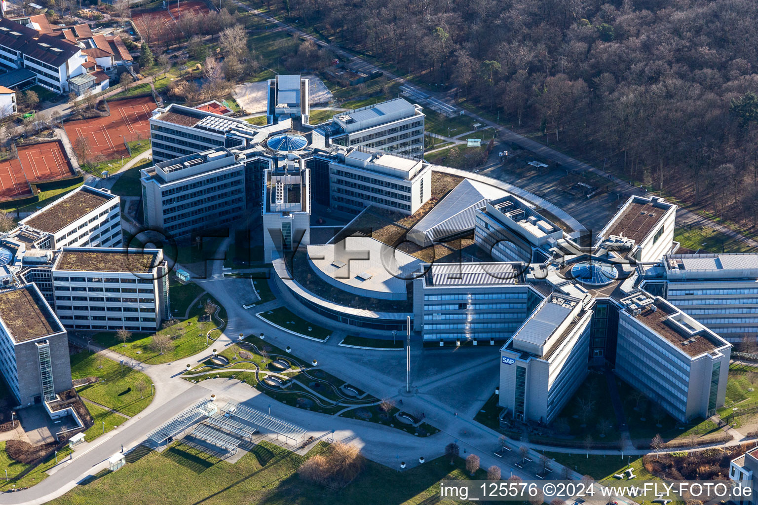 Oblique view of Star-shaped office buildings of the SAP Deutschland SE & Co. KG at the forest edged in Walldorf in the state Baden-Wuerttemberg