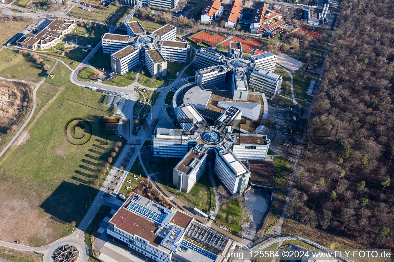 Bird's eye view of Star-shaped office buildings of the SAP Deutschland SE & Co. KG at the forest edged in Walldorf in the state Baden-Wuerttemberg