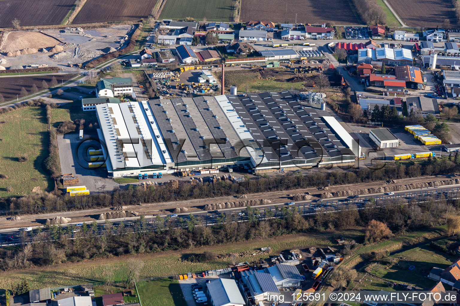 Aerial view of Buildings and production halls on the factory premises of the Smurfit Kappa Wellpappe Suedwest GmbH in Sankt Leon-Rot in the state Baden-Wuerttemberg, Germany